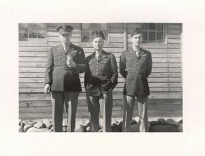 Image of Lt. Rutledge holding Cheek, Lt. Cohen, Lt. Harry Belo