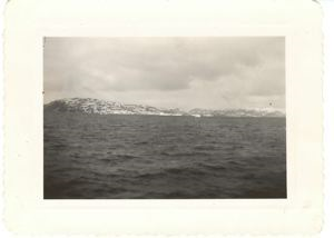 Image: View across water to icebergs and low hills, looking toward Bluie West 1