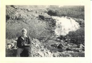 Image: Martha Burt sitting near Bluie West 1 waterfall in spring