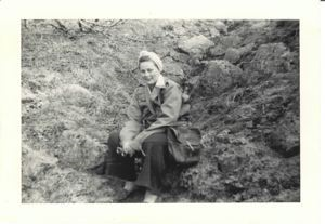 Image: Martha Burt sitting on incline by scrub trees