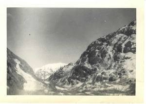 Image of Snow covered peak and frozen waterfall