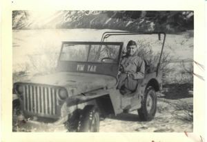 Image of Rutledge in a jeep - Vin Yan