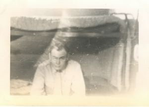 Image of Officer sitting on lower bunk
