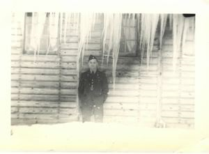 Image: Officer outside his barracks. Big icicles