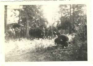 Image of Boys gathered for chow in the field