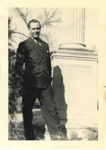 Image of Rutledge in civilian clothes by a Cheyenne church
