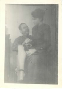 Image: Rutledge seated with dog; Lois on his knee