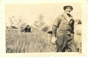 Image: Man walking in field at Fort Warren