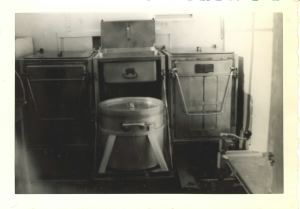 Image of Mobile kitchen equipment, detail: black-out vent, range from back, utensil cabin