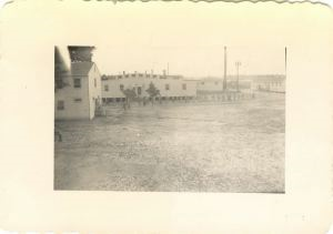 Image of Buildings on base; group of soldiers walking