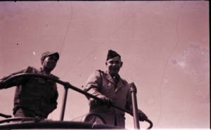 Image of Two men standing by upper rail of vessel