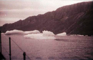 Image of Dying icebergs along coastal mountains