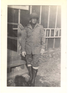 Image of Man in light jacket, helmet, high boots