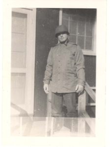 Image of Man standing on steps at Camp Miles Standish