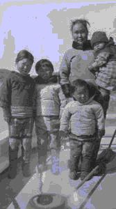 Image of Eskimo [Inuit] mother and children aboard