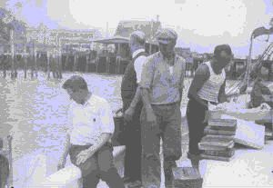 Image of Three crewmen and Donald MacMillan, aboard
