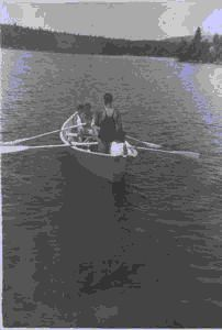 Image of Crewmen rowing dory