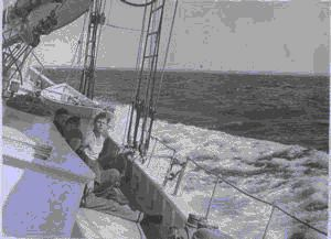 Image: Crewmen sitting on deck - starboard list