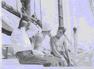 Image of Three crewmen sitting on deck