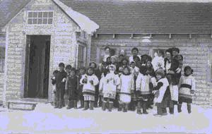 Image of Large group of school chiildren with Kate Hettasch, outside school