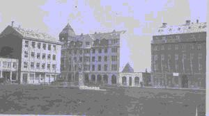Image of Buildings by park with statue . Hotel Borg at far right