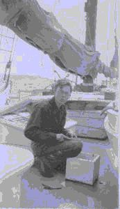 Image of Crewman on deck with record box