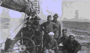 Image of Crewmen by wheel, including William Thomas, jr.