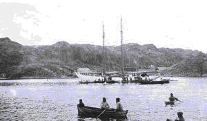 Image of Native boats and kayaks greet the BOWDOIN