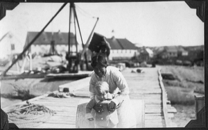 Image of Martha and 'young Tomlinson' on dock