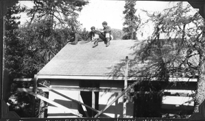 Image: Joseph Field, Novio Bertrand, Henry Warren sitting atop roof