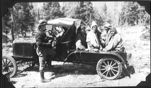 Image of Novio Bertrand and six Nascopie Indians in snowmobile