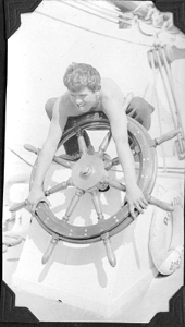 Image of Crewman leaning over wheel