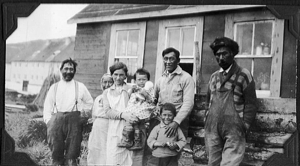 Image of Eskimo [Inuit] family by home