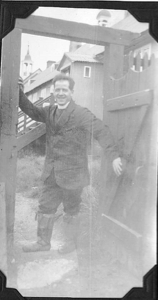 Image: Pastor at church gate