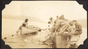 Image of Hauling of seine nets being photographed (movie camera)