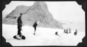 Image: Seven men on snow with equipment [Blurred]