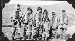 Image of Seven Eskimo [Inuit] boys, in furs