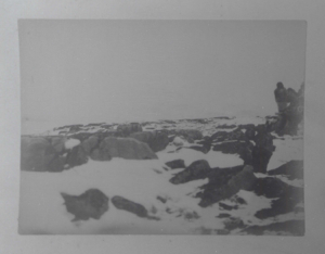 Image of Snow and rocks. Inuit beyond  