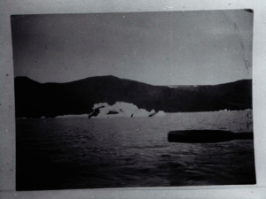 Image of Icebergs, mountains. Oar poised in foreground  
