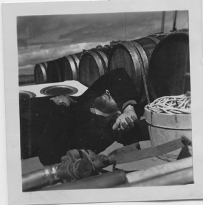 Image of Dick Backus asleep on deck