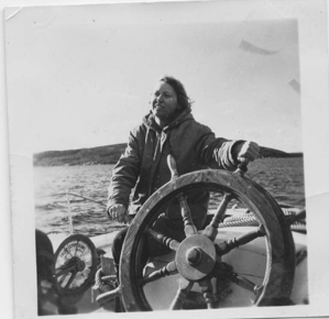 Image of Babs Nutt at wheel. Entrance to Hamilton Inlet