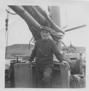 Image of Captain Trace (?) Perry standing on fo'csle watch on the MIMI MATILDE