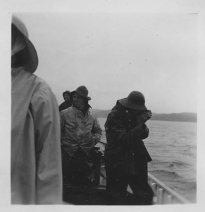 Image: Crew in foul weather gear, enroute to cod traps