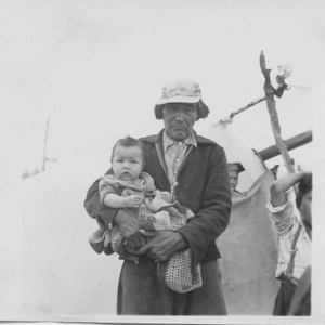 Image: Grandfather Michel holding grandson