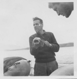 Image of Crewman holding grouper fish
