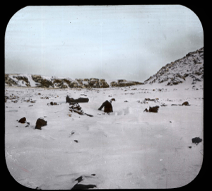 Image of Examining remains of Greely huts at Eskimo Point