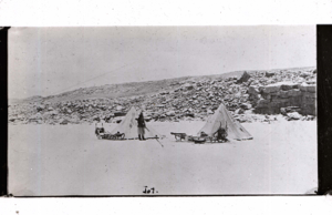 Image of Hunter [Jot Small] by two tents and two sledges