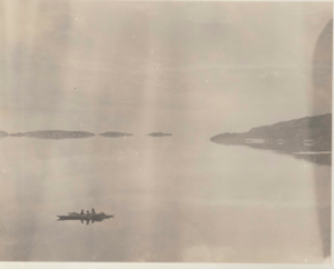 Image of Harbor from house; three kayakers in foreground