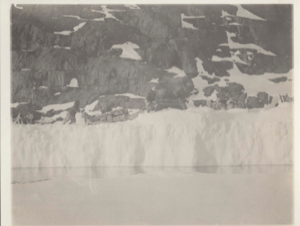 Image of Akpalezooahsua's sledge on narrow ice foot opposite Littleton island