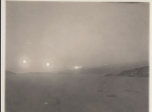 Image of Three setting suns and cloud effect